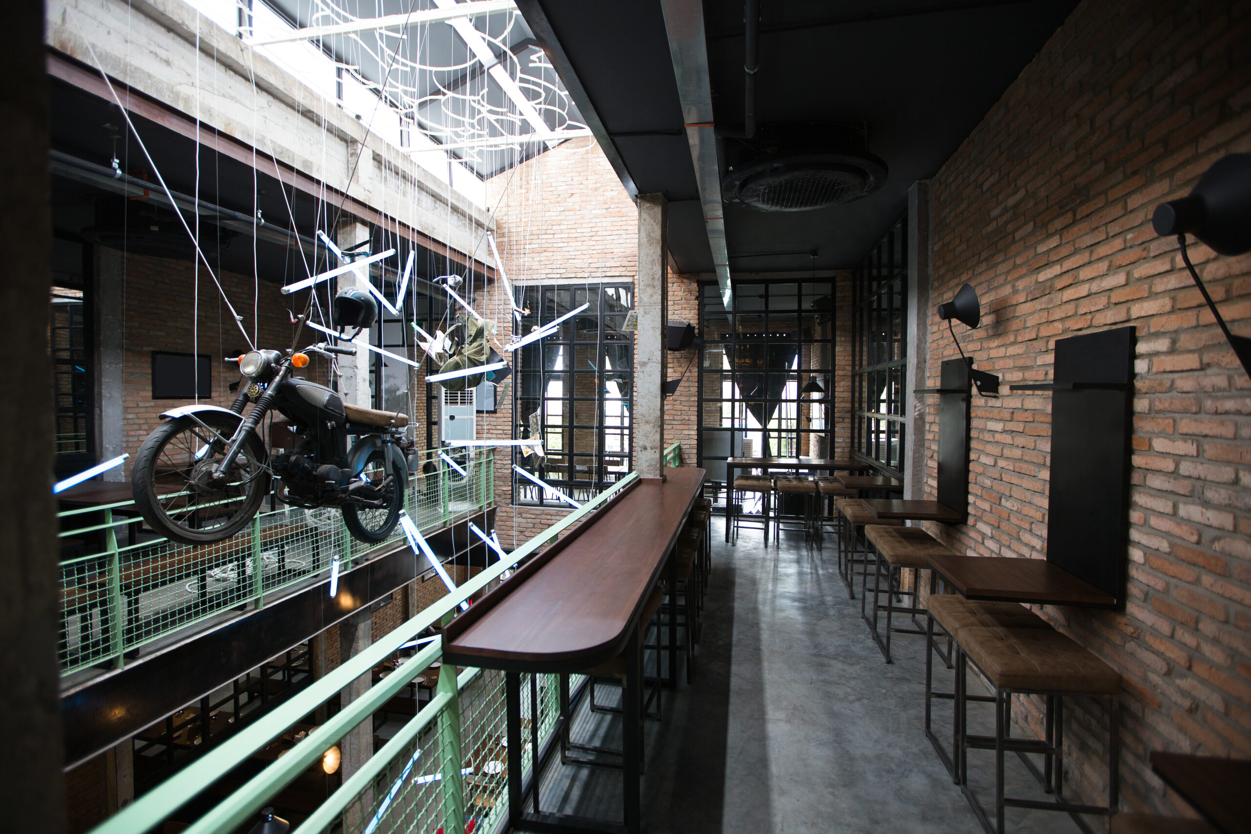 Empty pub interior with motorcycle installation